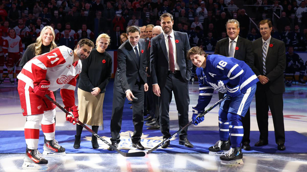 The Class of 2024 takes part in the ceremonial puck drop at the 2024 Hockey Hall of Fame Game.